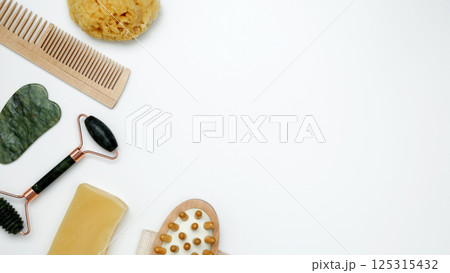 Embodying a sustainable self-care concept. Eco-friendly beauty essentials, marble face roller 125315432