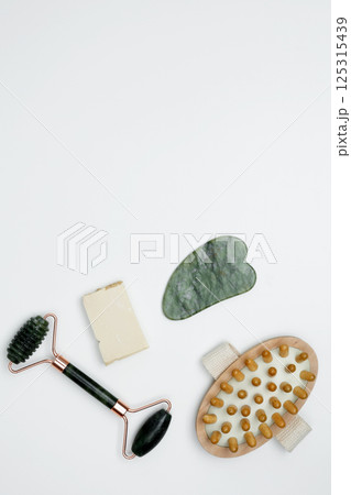 Embodying a sustainable self-care concept. Eco-friendly beauty essentials, marble face roller Embodying a sustainable self-care concept. Eco-friendly beauty essentials, marble face roller 125315439