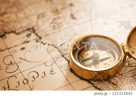 Compass with vintage map 125315642
