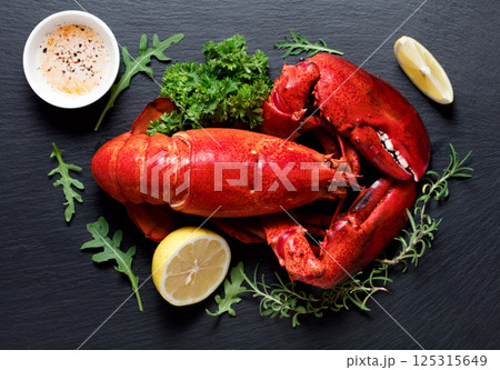 Red lobster with fresh parsley and lemon 125315649