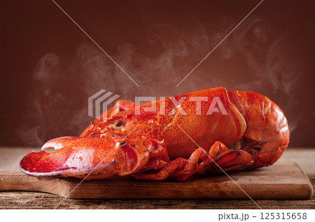 Boiled lobster on wooden background Boiled lobster on wooden background 125315658