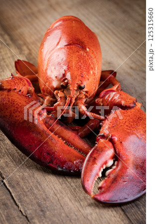 Boiled lobster on wooden background 125315660