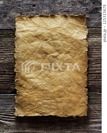 old paper on aged wooden background old paper on aged wooden background 125315678