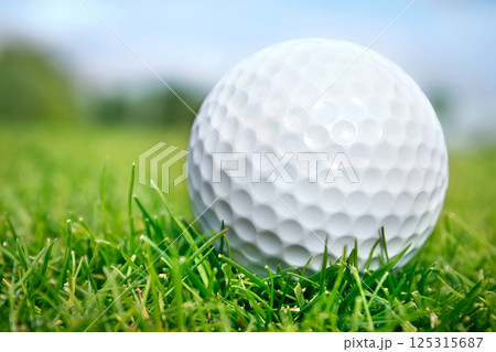 Golf ball on grass 125315687