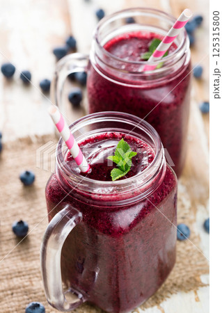 Berry smoothie on wooden table 125315800