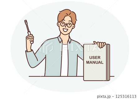 Guy with screwdriver shows book with inscription user manual recommending use educational literature 125316113