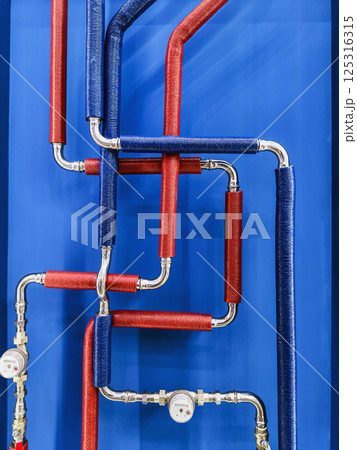 Colorful pipe arrangement showcasing modern plumbing design in a commercial setting Colorful pipe arrangement showcasing modern plumbing design in a commercial setting 125316315