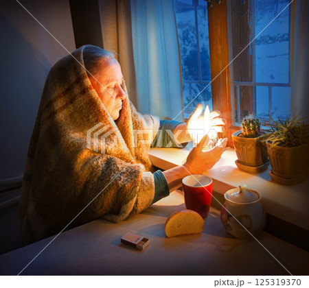 Woman with candles. Power outage in Kyiv Woman with candles. Power outage in Kyiv 125319370