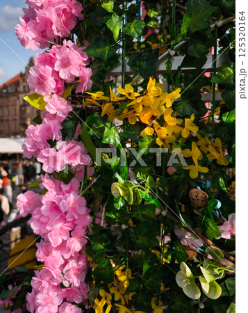 Pink and yellow artificial flowers decorating easter market in prague old town square 125320164
