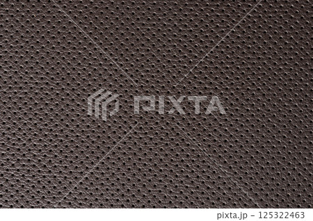 Close up of perforated brown leather Close up of perforated brown leather 125322463