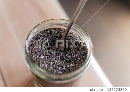 Chia seeds in a kitchen, superfood, full of antioxidant and omega 3, good for transit, sleep, bones, heart 125323260
