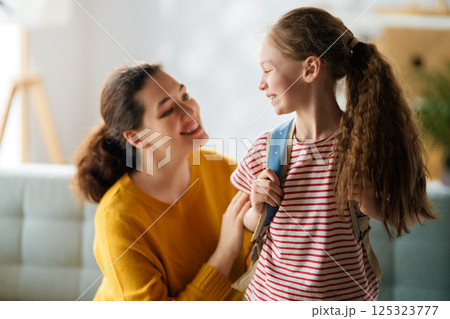 Happy family preparing for school 125323777