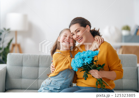 daughter and mom with flowers daughter and mom with flowers 125323805