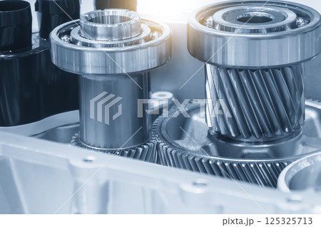 Close up scene the electric vehicle transmission gear parts in the light blue scene. 125325713