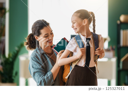 Happy family preparing for school Happy family preparing for school 125327011