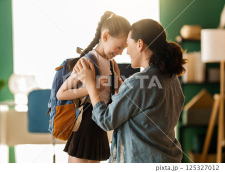 Happy family preparing for school Happy family preparing for school 125327012