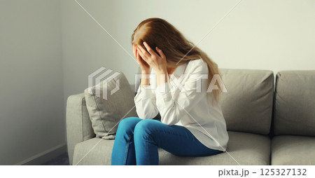 Upset sad crying woman while experiencing mental suffering, depression, fatigue, emotional stress Upset sad crying woman while experiencing mental suffering, depression, fatigue, emotional stress 125327132