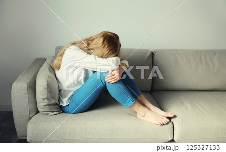 Upset sad crying woman while experiencing mental suffering, depression, fatigue, emotional stress Upset sad crying woman while experiencing mental suffering, depression, fatigue, emotional stress 125327133