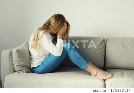 Upset sad crying woman while experiencing mental suffering, depression, fatigue, emotional stress Upset sad crying woman while experiencing mental suffering, depression, fatigue, emotional stress 125327134