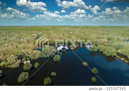 Surrounded by hurricane Ian rainfall flood waters homes in Florida residential area. Aftermath of natural disaster 125327141
