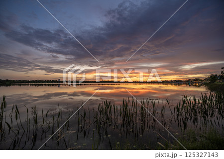 Sunset over lake water in southern tropical wetlands. Amazing Florida nature 125327143