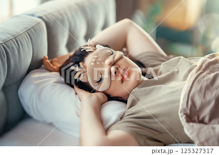 woman is sleeping in the bedroom 125327317