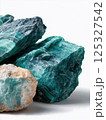 Macro close-up of beautiful malachite gemstones showing layered green rings and smooth texture. Studio mineral photography. Geology and decorative stone concept. Design for print, wallpaper, banner. 125327542