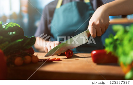 Woman is preparing the proper meal in the kitchen 125327557