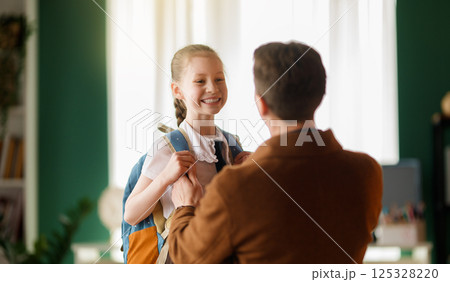 Happy family preparing for school Happy family preparing for school 125328220
