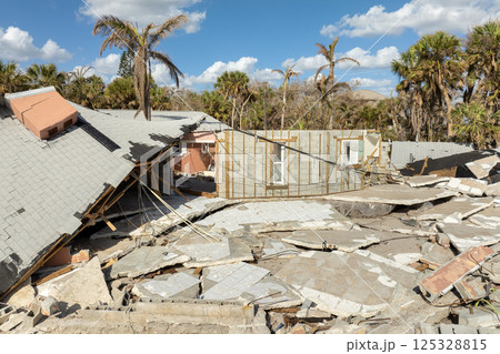 Natural disaster and its consequences. Hurricane destroyed houses roof and walls in Florida coastal area 125328815