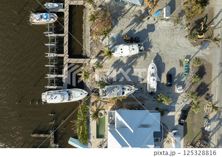 Natural disaster aftermath. Destroyed yachts after hurricane Milton on Manasota Key in Englewood, Florida Natural disaster aftermath. Destroyed yachts after hurricane Milton on Manasota Key in Englewood, Florida 125328816