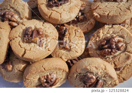 the cracked shortbread cookies with walnuts. sweet biscuit. whea the cracked shortbread cookies with walnuts. sweet biscuit. whea 125328824