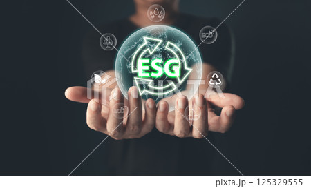 The glowing ESG icon symbolizes commitment to environmental, social,and governance principles,emphasizing sustainability,ethical practices,and eco-friendly solutions for a balanced,responsible future. The glowing ESG icon symbolizes commitment to environmental, social,and governance principles,emphasizing sustainability,ethical practices,and eco-friendly solutions for a balanced,responsible future. 125329555