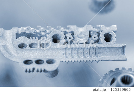 Metal object printed on 3D printer from metal powder. Model created on 3D printer from metal powder. Metal Jet technology. New modern 3D printing technologies. Additive progressive technology. Concept 125329666