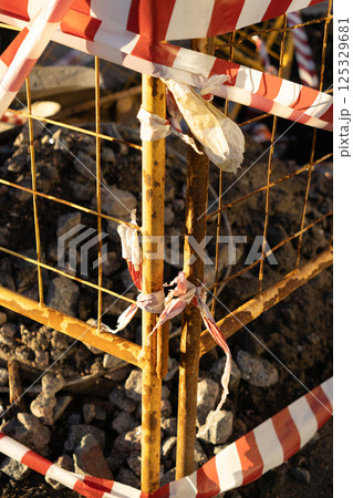 structure is metal with a red and white ribbon, dangerous territory. structure is metal with a red and white ribbon, dangerous territory. 125329681