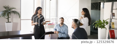 Team leading discussion in modern office, horizontal wide view 125329876