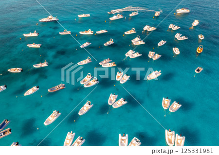 Aerial view of luxury yacht and boat in blue sea in summer 125331981