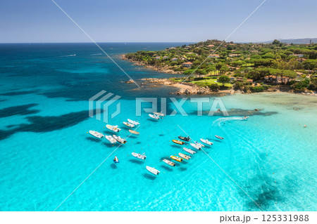 Aerial view of luxury yachts and boats on blue sea, island Aerial view of luxury yachts and boats on blue sea, island 125331988
