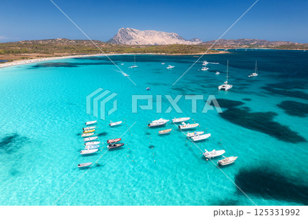 Aerial view of luxury yachts and boats on blue sea, island 125331992