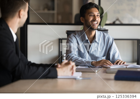 Happy Indian CEO business man holding group Happy Indian CEO business man holding group 125336394