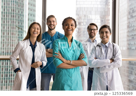 Modern day doctors posing for portrait in contemporary clinic office 125336569