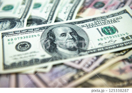 Thick wad of money cash on table 125338287