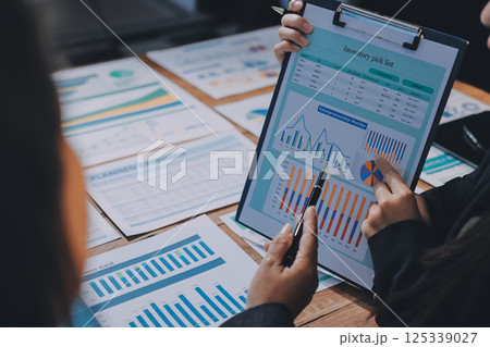 Business analyze,Close up Business people meeting to discuss the situation on the market. Business Financial Concept 125339027