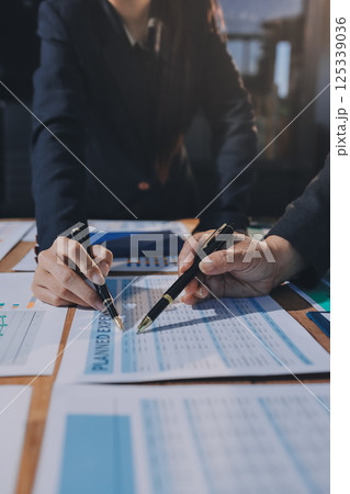 Business analyze,Close up Business people meeting to discuss the situation on the market. Business Financial Concept 125339036