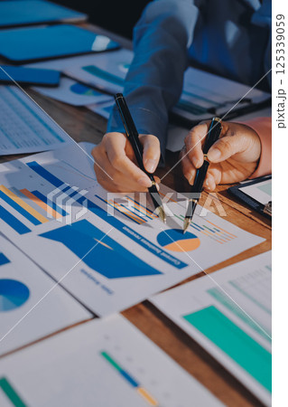 Business analyze,Close up Business people meeting to discuss the situation on the market. Business Financial Concept Business analyze,Close up Business people meeting to discuss the situation on the market. Business Financial Concept 125339059