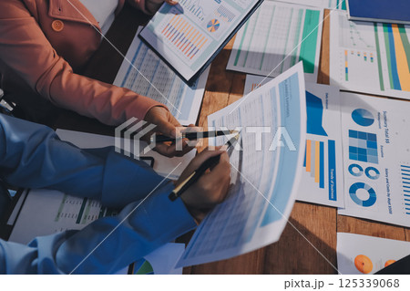 Business analyze,Close up Business people meeting to discuss the situation on the market. Business Financial Concept Business analyze,Close up Business people meeting to discuss the situation on the market. Business Financial Concept 125339068