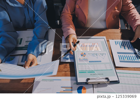 Business analyze,Close up Business people meeting to discuss the situation on the market. Business Financial Concept Business analyze,Close up Business people meeting to discuss the situation on the market. Business Financial Concept 125339069