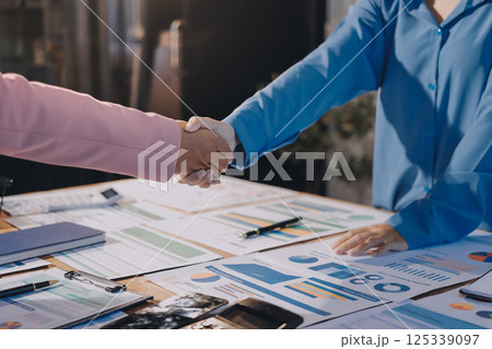 Business success. Business people shaking hands agreement confirmed in the investment business. 125339097