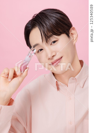 Portrait of a young man posing with a tint 125340589