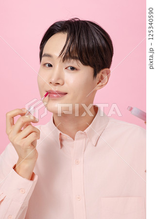 Portrait of a young man posing with a tint 125340590